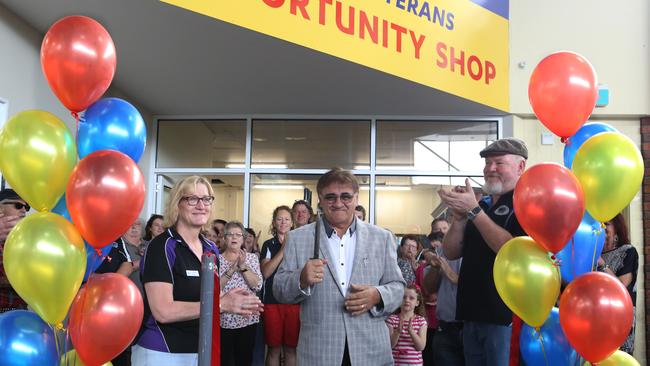 Aussie Veterans Opportunity Shop owners Fiona and Mick Quinn, with Boronia Mall centre manager Lawrence Peresso (centre) cut the ribbon to open the new store. Picture: Stuart Milligan