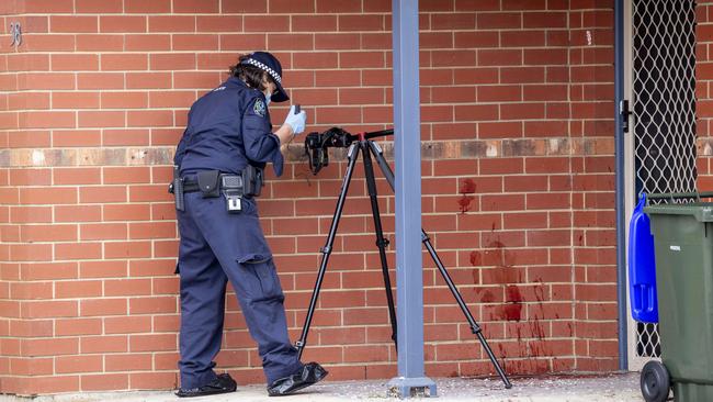 Major Crime officers at the alleged murder scene. Picture: Brett Hartwig