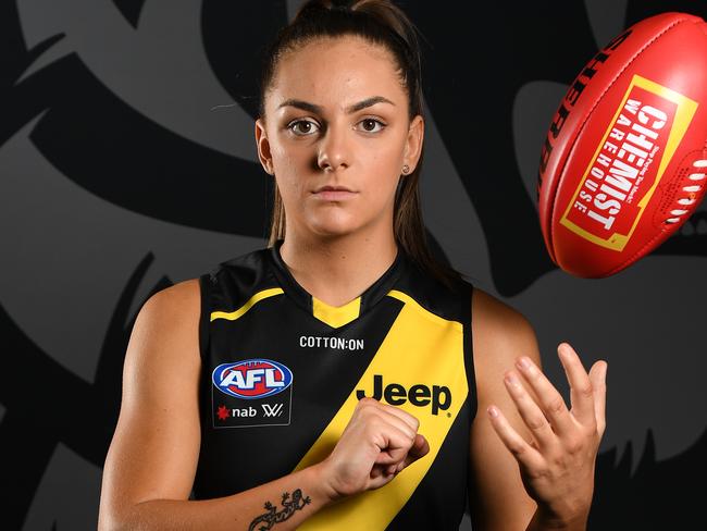 Monique Conti of the Tigers poses for a photograph in the Swinburne Centre at Punt Road Oval, Melbourne, Monday, January 20, 2019. Richmond AFLW players have had their official team photos completed today. (AAP Image/James Ross) NO ARCHIVING