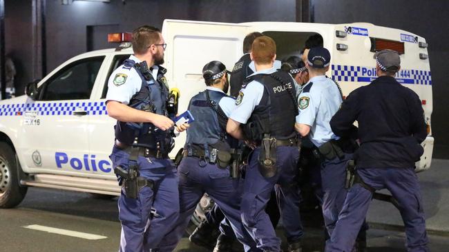 A man is arrested by police in Kings Cross after he was allegedly trying to start fights with strangers, before being detained by police.