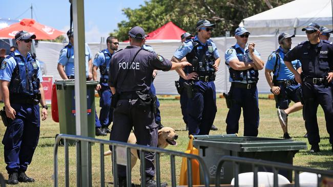 Police and sniffer dogs check patrons as they enter the Electric Gardens festival. Picture: Toby Zerna