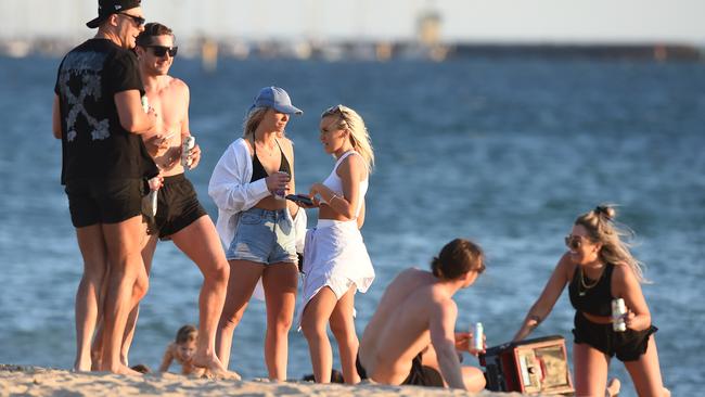 A group drinks and listens to music on Thursday afternoon. Picture: Josie Hayden