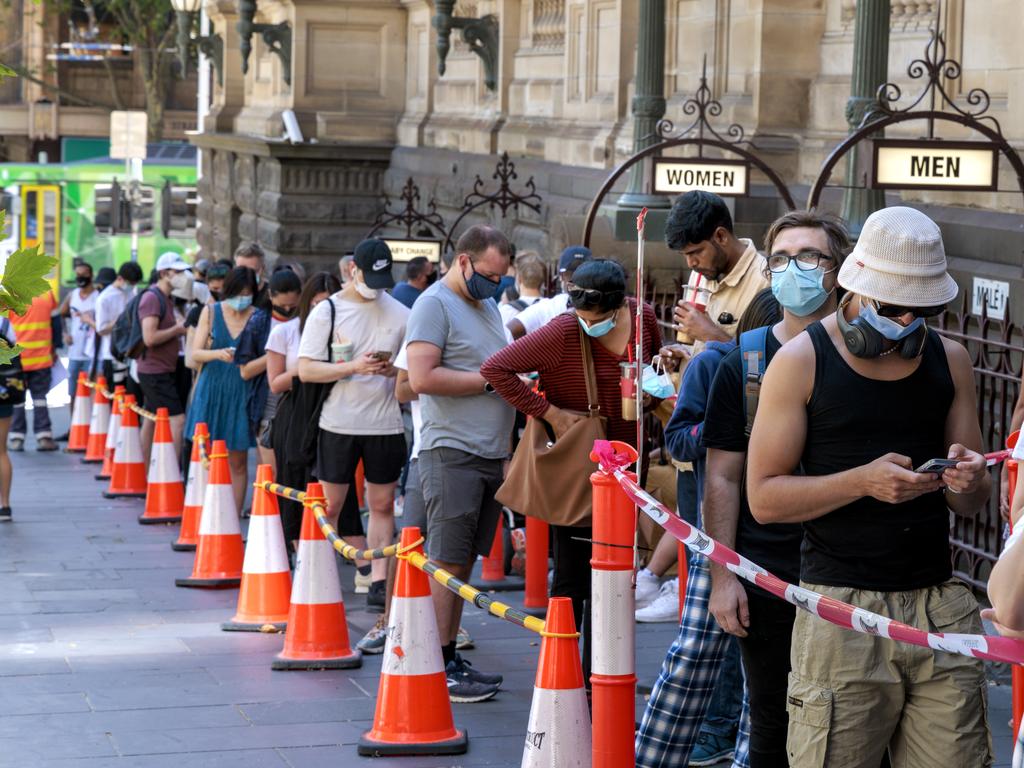 People queue for Covid testing at Melbourne Town Hall in Friday afternoons extreme heat as other sites were closed due to the heat. Picture: NCA NewsWire / David Geraghty