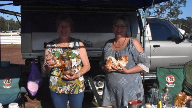 SWAP MEET: Louise Gardner and Sue Currey from Ipswich show off their glassware at the Maryborough swap meet. Photo: Stuart Fast