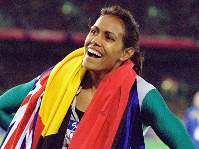 25 Sep 2000:  Cathy Freeman of Australia celebrates gold in the Womens 400m Final at the Olympic Stadium on Day Ten of the Sydney 2000 Olympic Games in Sydney, Australia. \\ Mandatory Credit: Nick Wilson /Allsport