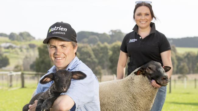 Andrew Lakin and partner Lauren Russell with a Suffolk ram and a seven-day-old lamb. Picture: Zoe Phillips