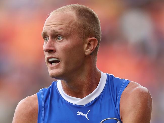 SYDNEY, AUSTRALIA - MARCH 16: Jaidyn Stephenson of the Kangaroos runs the ball during the round one AFL match between Greater Western Sydney Giants and North Melbourne Kangaroos at ENGIE Stadium on March 16, 2024 in Sydney, Australia. (Photo by Jason McCawley/AFL Photos/via Getty Images )