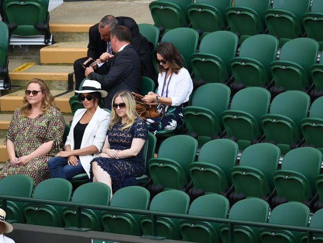 Meghan Duchess of Sussex and her two friends surrounded by lots of empty seats at Wimbledon. Picture: James Veysey/Shutterstock