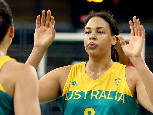 RIO DE JANEIRO, BRAZIL - AUGUST 11:  Marianna Tolo #14 and Elizabeth Cambage #8 of Australia celebrate against Japan during a Women's Preliminary Group B match on Day 6 of the Rio 2016 Olympics at the Youth Arena on August 11, 2016 in Rio de Janeiro, Brazil.  (Photo by Sean M. Haffey/Getty Images)