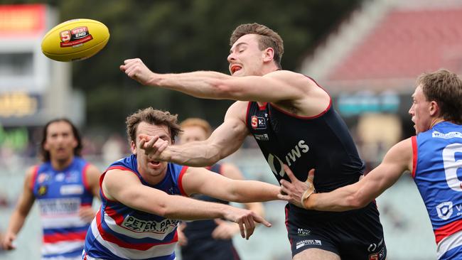 Harry Boyd from Norwood handballs during the SANFL semi-final match between Norwood and Central Districts at Adelaide Oval in Adelaide, Sunday, September 8, 2024. (SANFL Image/David Mariuz)