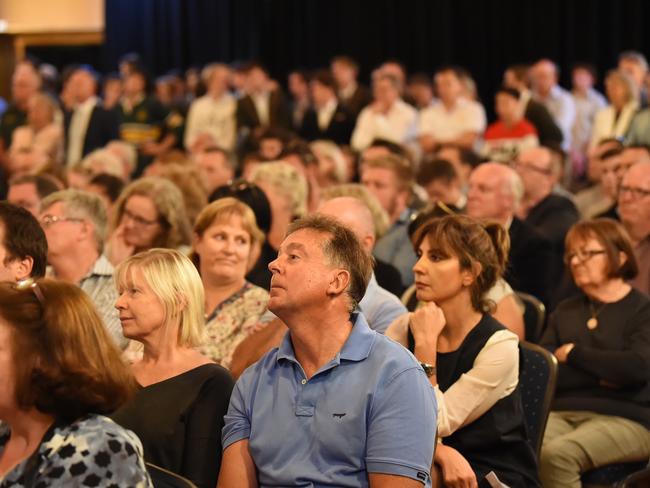 A large crowd listens on at the Trinity Grammar school community meeting. Picture: Lawrence Pinder