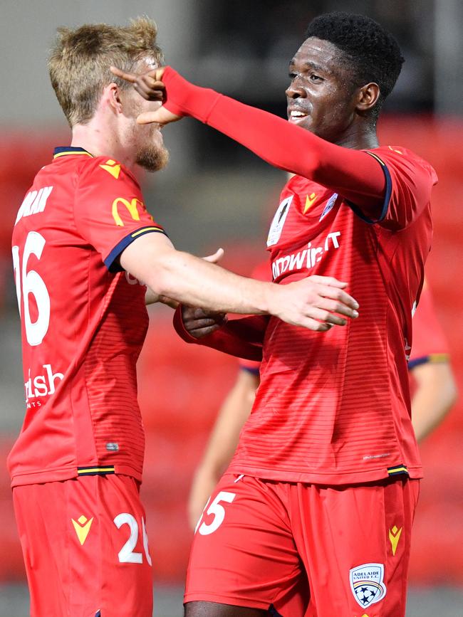 Adelaide United teenager Al Hassan Toure in FFA Cup action against Newcastle (left) and celebrating his winning goal with teammate Ben Halloran. Picture: AAP Image/David Mariuz