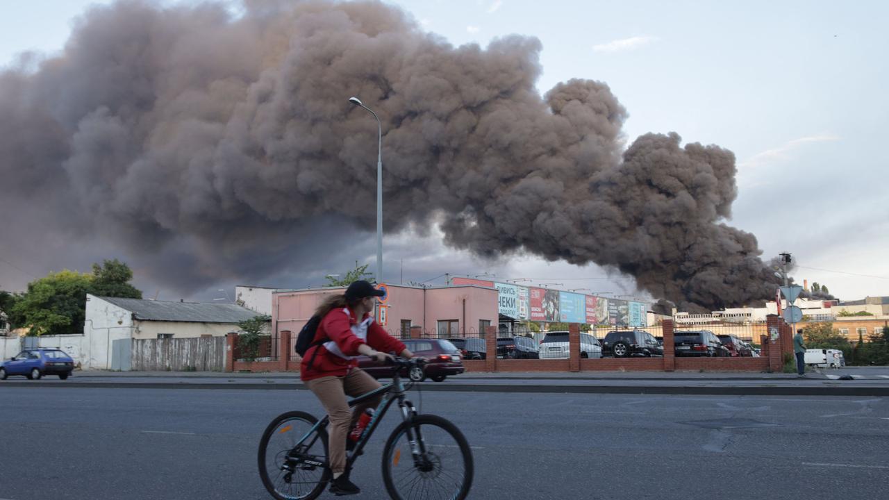 A cloud of smoke billows into the air after a missile strike on a warehouse of an industrial and trading company in Odessa. Picture: Oleksandr GImanov/AFP