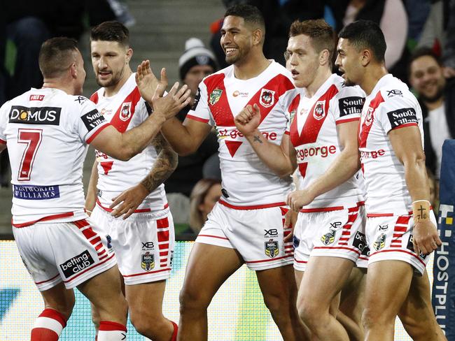 Dragons players celebrate a Nene Macdonald (centre) try during the Round 17 NRL match between the Melbourne Storm and the St George-Illawarra Dragons at AAMI Park in Melbourne, Thursday, July 5, 2018. (AAP Image/Daniel Pockett) NO ARCHIVING, EDITORIAL USE ONLY