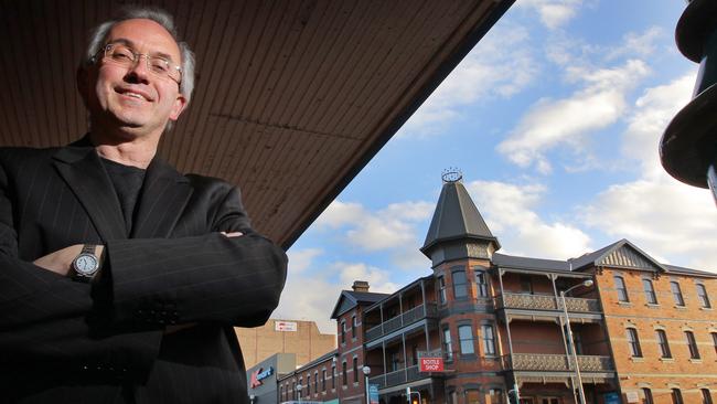 Burnie Mayor Steve Kons in front of his newly developed IKON Hotel at Burnie