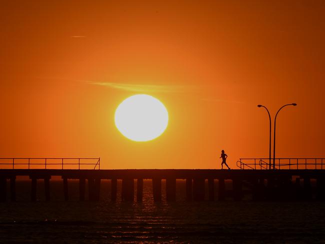 The sun rising over Melbourne yesterday morning. Picture: Nicole Garmston