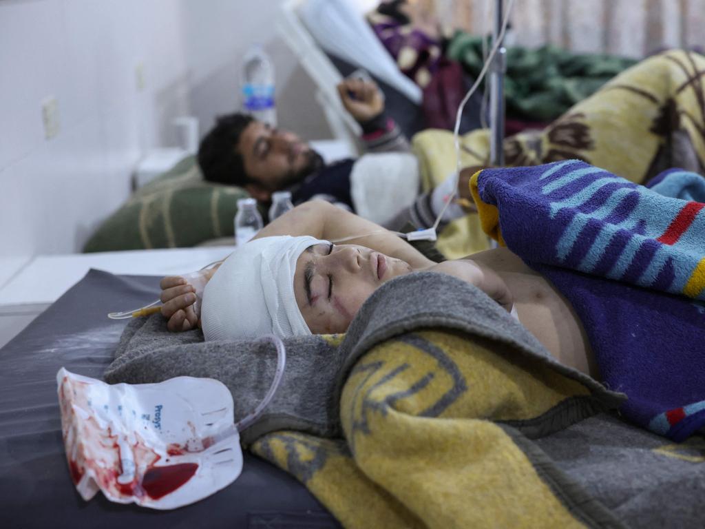 People injured in a morning earthquake receive treatment at al-Rahma hospital in Syria's town of Darkush, on the outskirts of the rebel-held northwestern province of Idlib. Picture: AFP