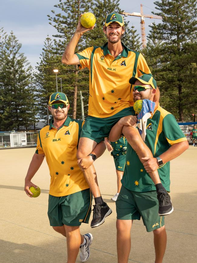 The retiring Nathan Rice is chaired off by teammates Aron Sherriff and Aaron Wilson. Picture: BOWLS AUSTRALIA