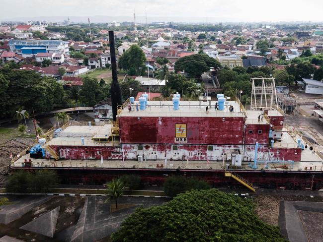 The PLTD Apung 1, a 2,600-ton diesel generator vessel that washed into a residential area during the 2004 tsunami, is now transformed into a tsunami-themed museum. AFP)