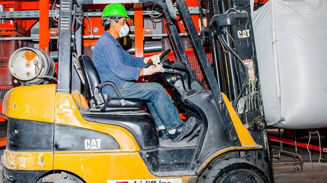 Average hourly earnings were up 2.5% in November from a year ago, versus an October gain of 2.8%. A forklift driver works at the IceStone manufacturing facility in Brooklyn, N.Y. PHOTO: DAVID WILLIAMS/BLOOMBERG