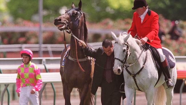 Something’s wrong with this picture: Disappointed jockey Lance O'Sullivan walks with brother and trainer Paul as Pravda’s tantrum continues. Picture: Craig Borrow