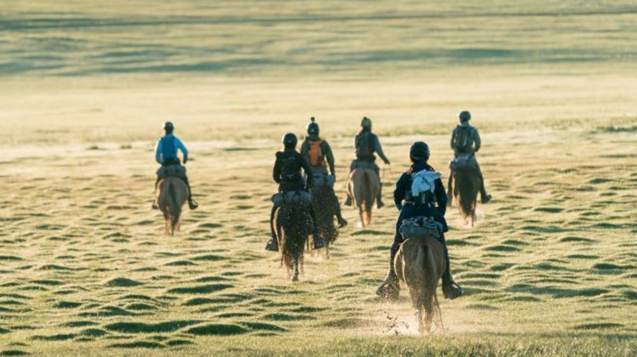 Mongol Derby riders crossing the Mongolian landscape. Picture: Twitter @mongolderbylive