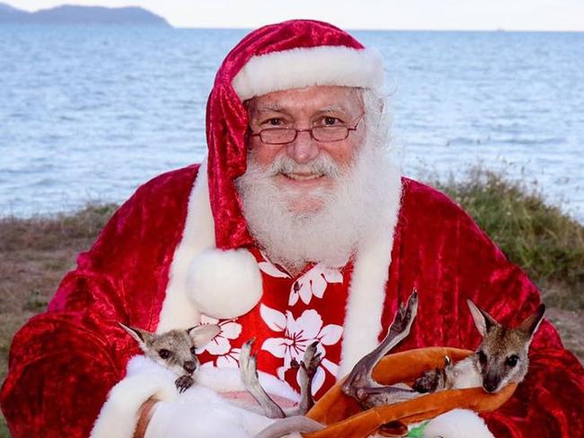 Tropical Santa Claus Lyle McGrath will spend his seventh year taking photos with families at Rowes Bay in collaboration with Jacqualyn Louise Photography.