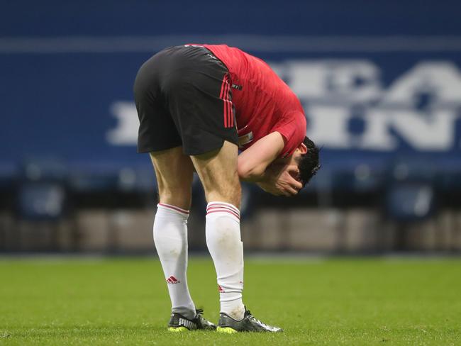 Manchester United's English defender Harry Maguire reacts at the end of the English Premier League football match between West Bromwich Albion and Manchester United at The Hawthorns stadium in West Bromwich, central England, on February 14, 2021. (Photo by Nick Potts / POOL / AFP) / RESTRICTED TO EDITORIAL USE. No use with unauthorized audio, video, data, fixture lists, club/league logos or 'live' services. Online in-match use limited to 120 images. An additional 40 images may be used in extra time. No video emulation. Social media in-match use limited to 120 images. An additional 40 images may be used in extra time. No use in betting publications, games or single club/league/player publications. /