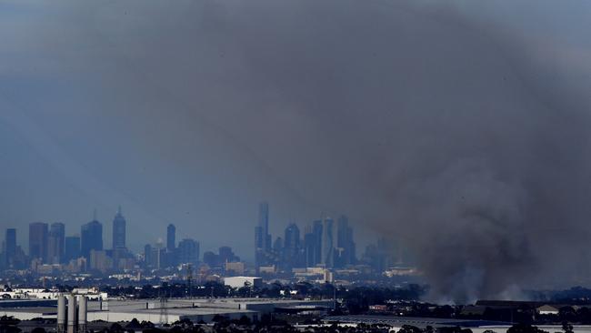 Smoke and ash blows across Melbourne. Picture: Nicole Garmston