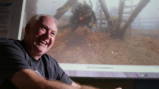 Central Coast Marine Discovery Centre chairman John Asquith shows off the impressive virtual tour of the ex-HMAS Adelaide. Pictures: Mark Scott