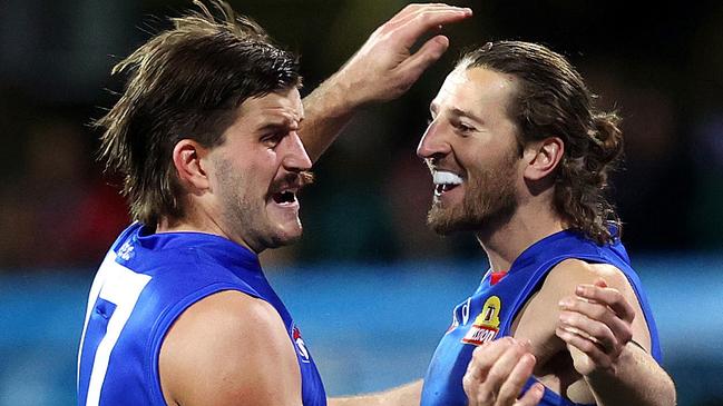 Western Bulldogs Josh Bruce celebrates kicking a goal with Marcus Bontempelli during AFL match between the Sydney Swans and Western Bulldogs at the SCG. Picture. Phil Hillyard