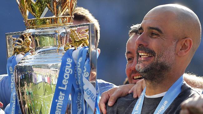 Manchester City manager Pep Guardiola lifts the English Premier League trophy at the weekend. Picture: AP