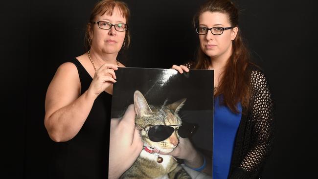 Jenny and Reanna Pierce with a photo of their beloved Mytzle. Picture: Lawrence Pinder