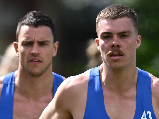 MELBOURNE, AUSTRALIA - NOVEMBER 17: Luke McDonald, Brayden George and Luke Davies-Uniacke and Cameron Zurhaar of the Kangaroos run laps during a North Melbourne Kangaroos AFL training session at Arden Street Ground on November 17, 2023 in Melbourne, Australia. (Photo by Quinn Rooney/Getty Images)