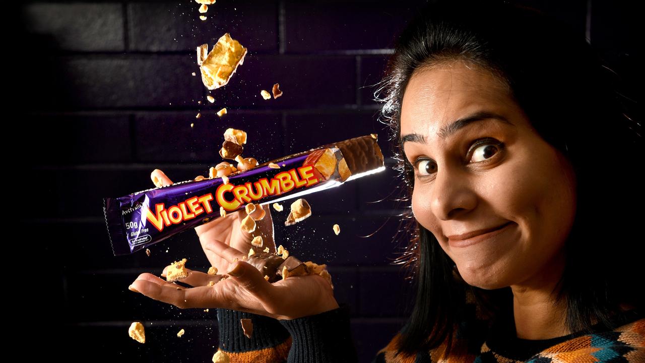 Robern Menz Innovations Manager Naureen Ahmed with a Violet Crumble, which carries the slogan “It’s the way it shatters that matters” on the recognisable purple and yellow packaging. Picture: Tricia Watkinson