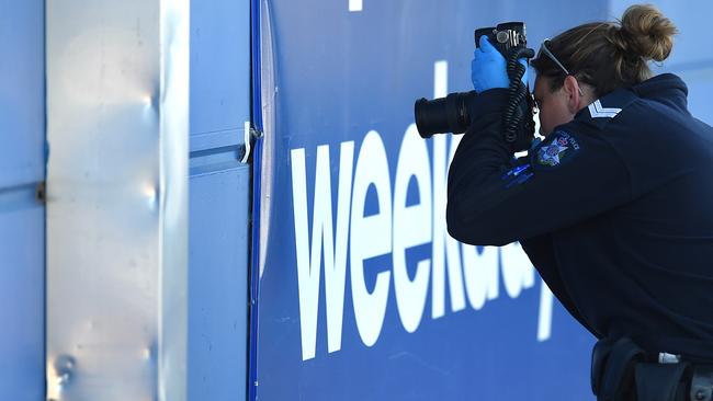 Detectives and forensic have returned to the scene of Monday’s fatal shooting at Officeworks in Campbellfield. Picture: Nicole Garmston