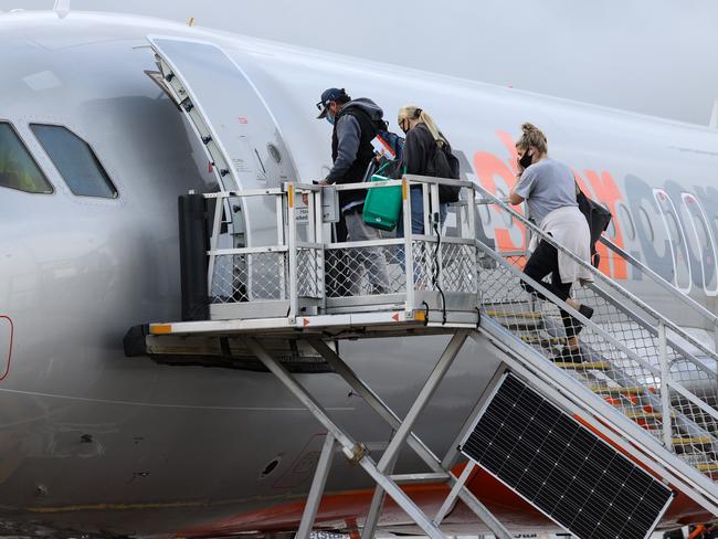 MELBOURNE,AUSTRALIA-NewsWire Photos NOVEMBER 23, 2020 : Borders around Australia begin to open up again during COVID-19. Passengers begin to board their Jetstar flight to Sydney at Melbourne Airport.Picture : NCA NewsWire / Ian Currie