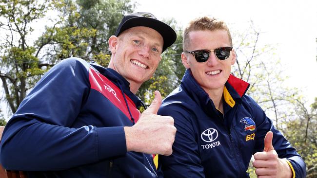 Sam Jacobs and Reilly O'Brien in the AFL grand final parade in 2017. Picture Sarah Reed