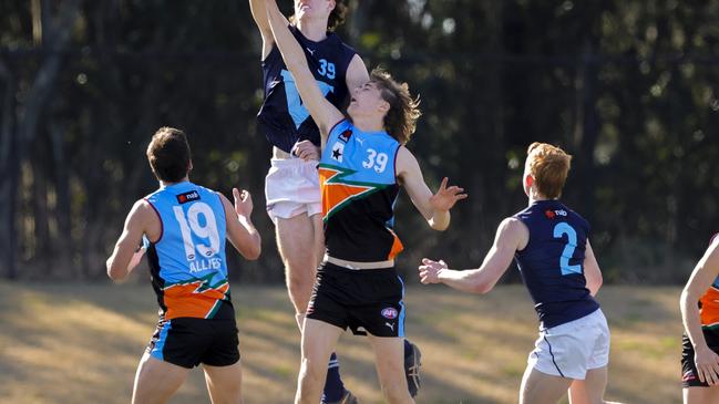 Hudson OKeeffe of Vic Metro (L) and Ethan Read of the Allies jump for a mark during the U18 AFL Boys Championship match between the Allies and Vic Metro at Blacktown International Sportspark on June 25, 2022 in Sydney, Australia. (Photo by Jenny Evans/Getty Images for AFL Photos)