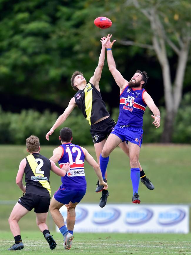 Townsville AFL match between Thuringowa Bulldogs and Hermit Park Tigers AFL at Riverway. Tigers Ryan Pickering and Bulldogs John Nolan. Picture: Evan Morgan