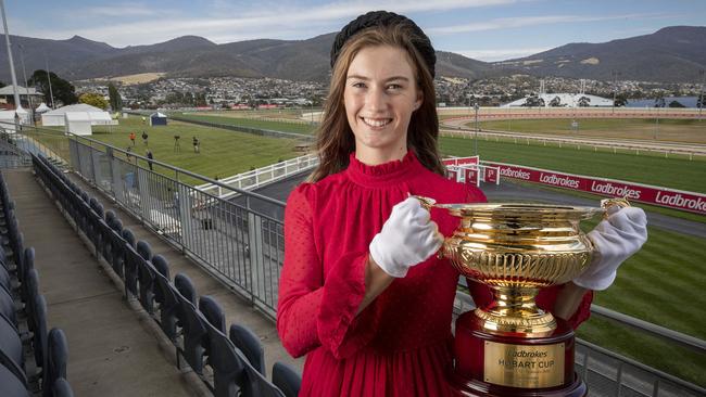 Captain Cook track work rider Ashley Meaburn with the Hobart Cup at Elwick Racecource. Picture: Chris Kidd