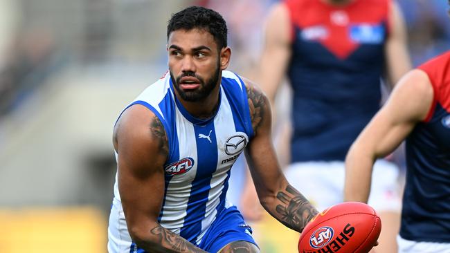 HOBART, AUSTRALIA - AUGUST 06: Tarryn Thomas of the Kangaroos runs the ball during the round 21 AFL match between North Melbourne Kangaroos and Melbourne Demons at Blundstone Arena, on August 06, 2023, in Hobart, Australia. (Photo by Steve Bell/Getty Images)