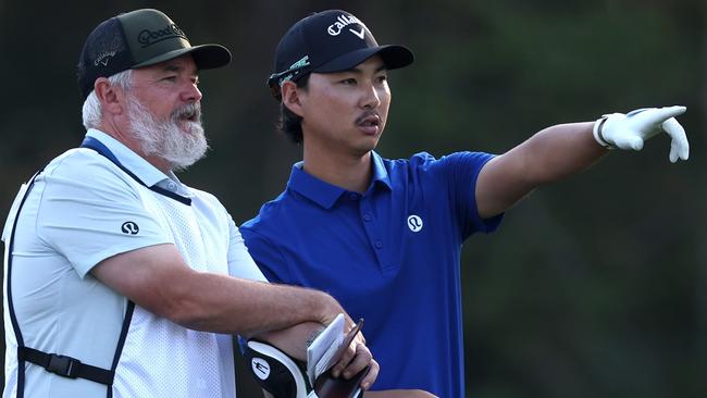 PONTE VEDRA BEACH, FLORIDA - MARCH 14: Min Woo Lee of Australia prepares for a shot with his caddie, Bo Martin, on the 14th hole during the second round of THE PLAYERS Championship on the Stadium Course at TPC Sawgrass on March 14, 2025 in Ponte Vedra Beach, Florida. (Photo by Richard Heathcote/Getty Images)