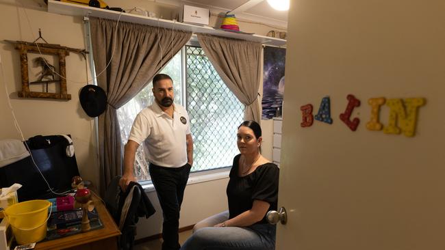 Michael and Kerri-Lyn Stewart in their son Balin’s bedroom, kept as it was when he was alive, complete with the crooked letter ‘L’ on his name. Picture: David Kelly