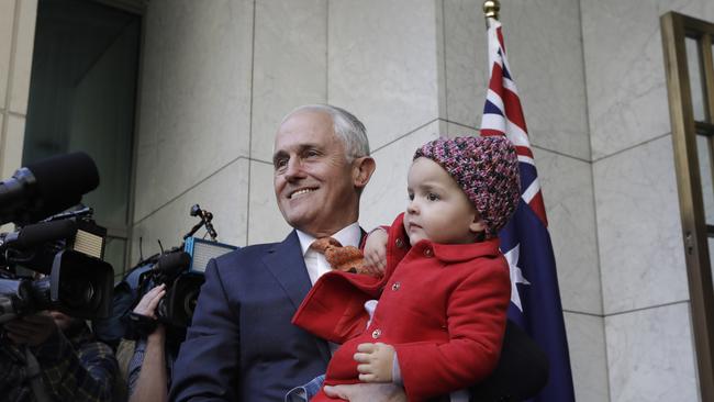 Malcolm Turnbull at his final press conference as prime minister, with his grand daughter Alice. (Pic: Sean Davey)