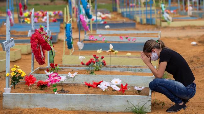 A woman grieves at the Nossa Senhora Aparecida cemetery in Manaus, Amazonas State, as cemeteries in Brazil opened last weekend for the first time since the start of the COVID-19 pandemic. Picture: AFP