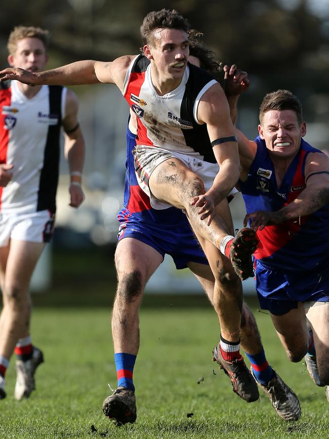 Koroit’s James Gow kicks long into attack.