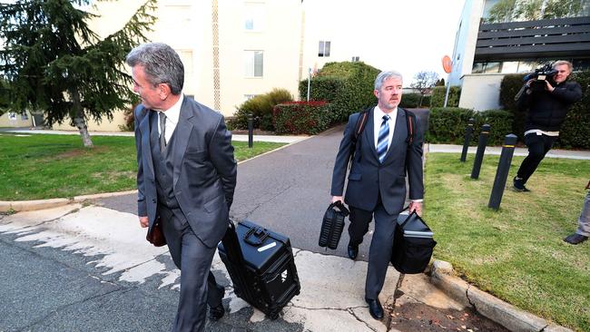 Federal police officers raiding the home back in 2019.