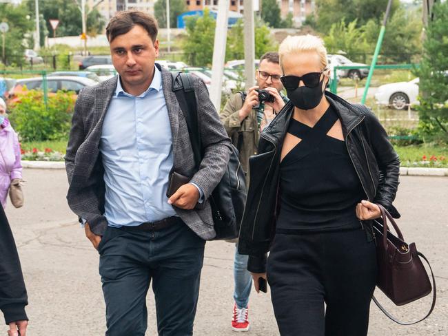 FBK anti-corruption foundation director Ivan Zhdanov and Yulia Navalny arrive at Omsk Emergency Hospital where Alexei Navalny was admitted after what his spokeswoman said was a suspected poisoning. Picture: AFP