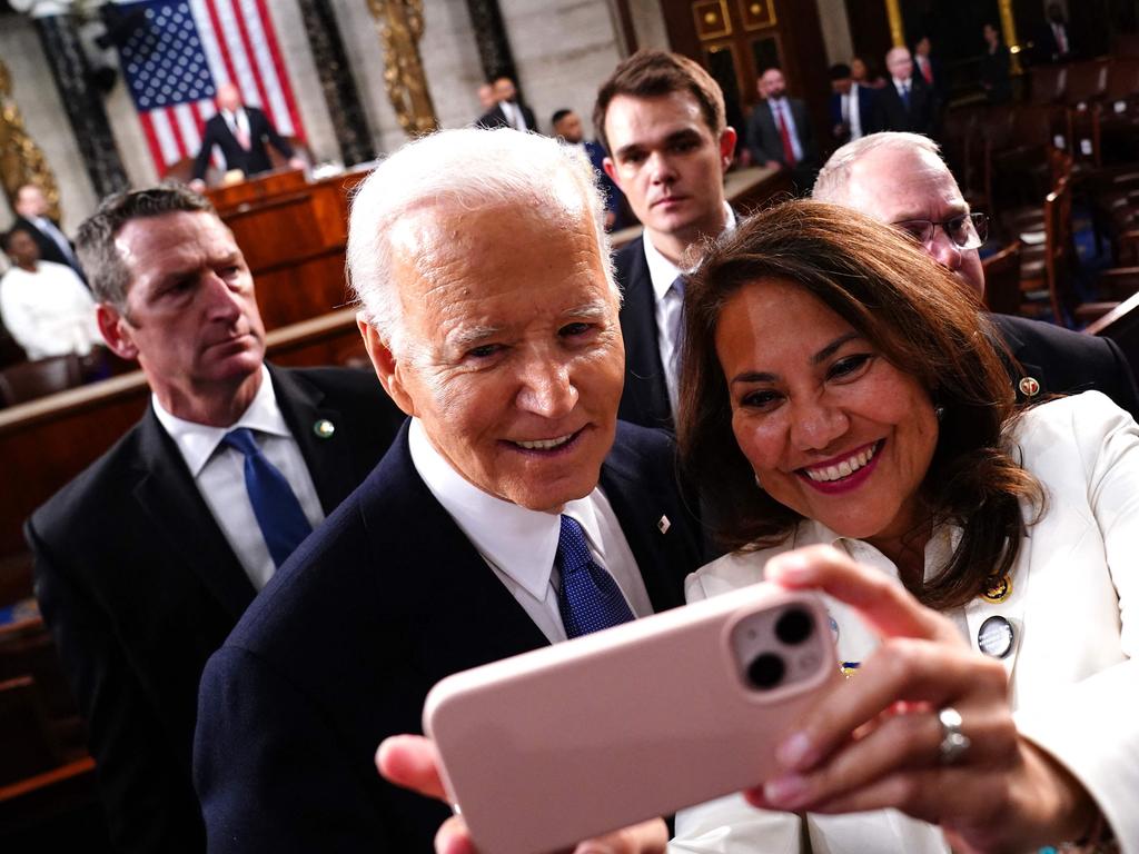 President Joe Biden takes a selfie as he departs after delivering his third State of the Union address. Picture: AFP